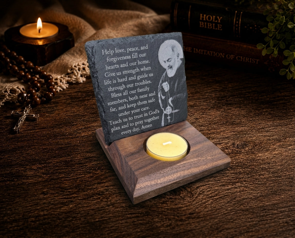 Artistic close-up of Padre Pio laser engraving, prayer, natural slate, black walnut base, and beeswax candle.