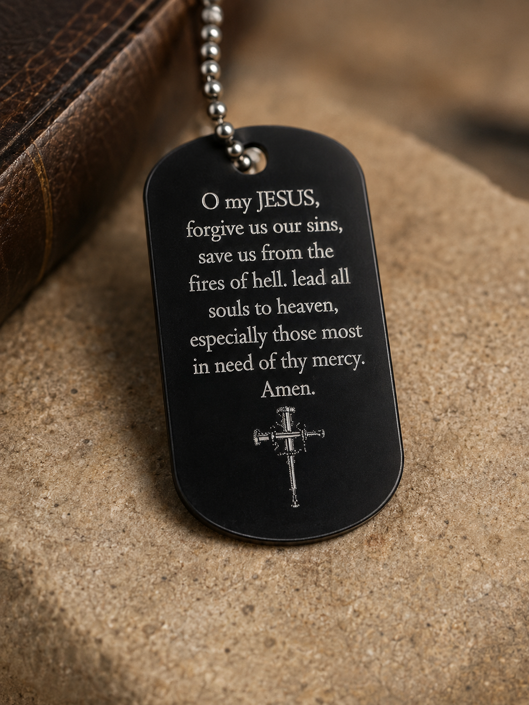 Close-up of the engraved Fatima Prayer on the back of the dog tag