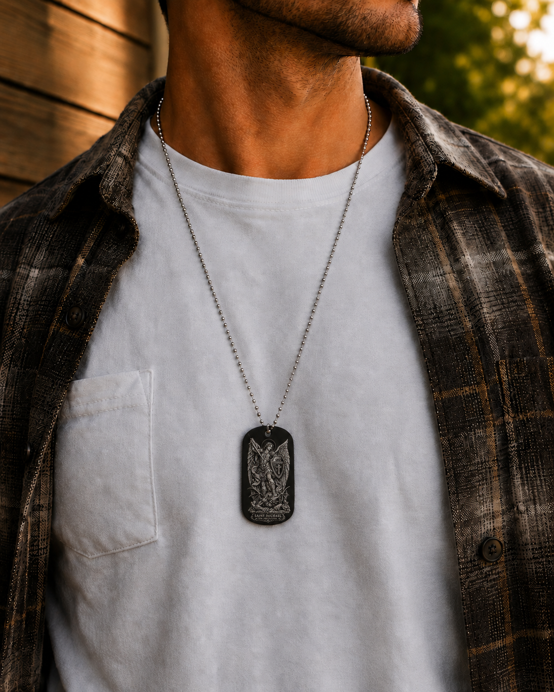 Saint Michael Catholic dog tag necklace worn on a man showing everyday size and appearance